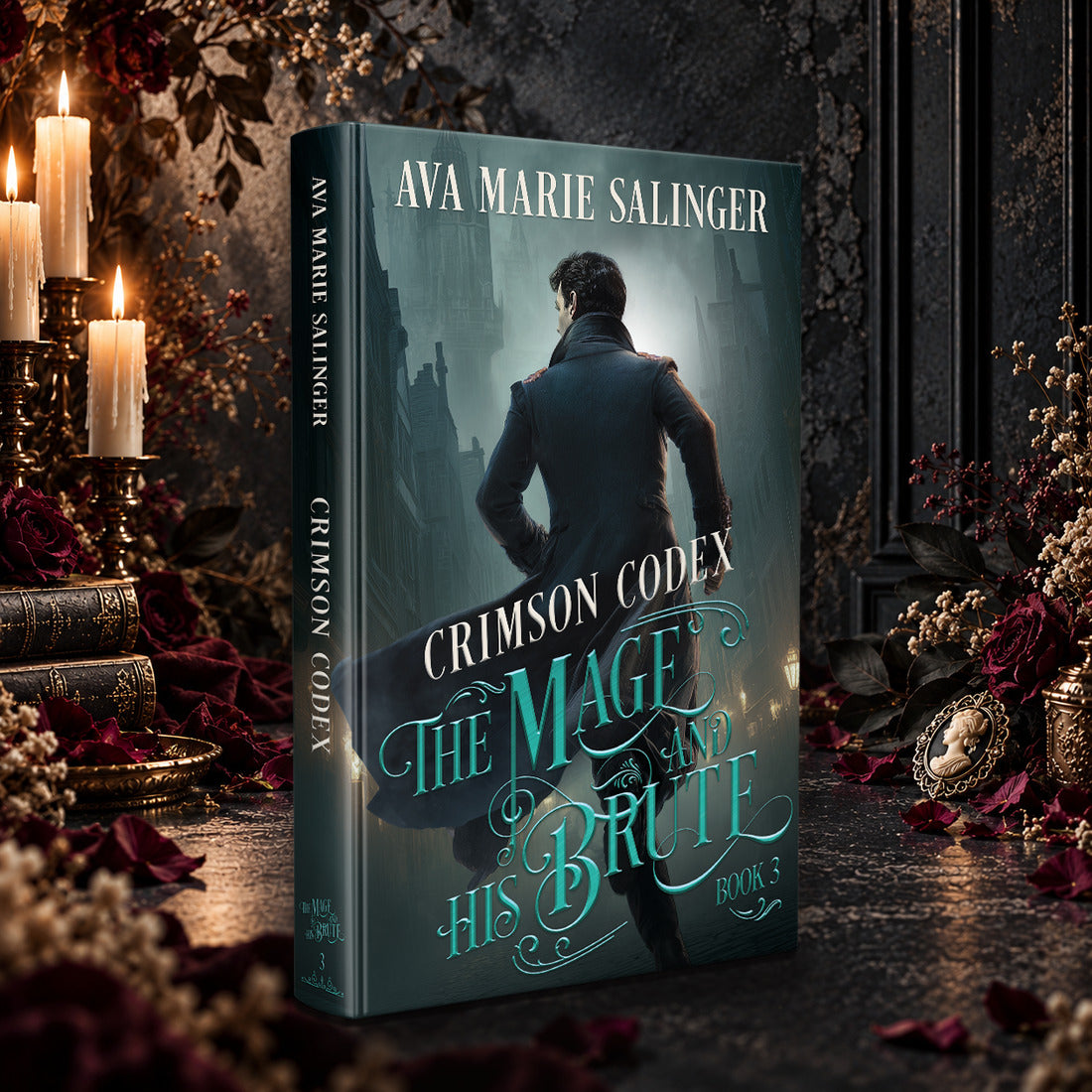 Crimson Codex (The Mage and His Brute Book 3) Hardback by Ava Marie Salinger among candles, red roses and a cameo pendant