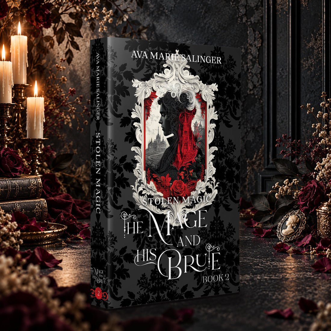 Stolen Magic (The Mage and His Brute Book 2) Special Edition Paperback by Ava Marie Salinger among candles, red roses and a cameo pendant