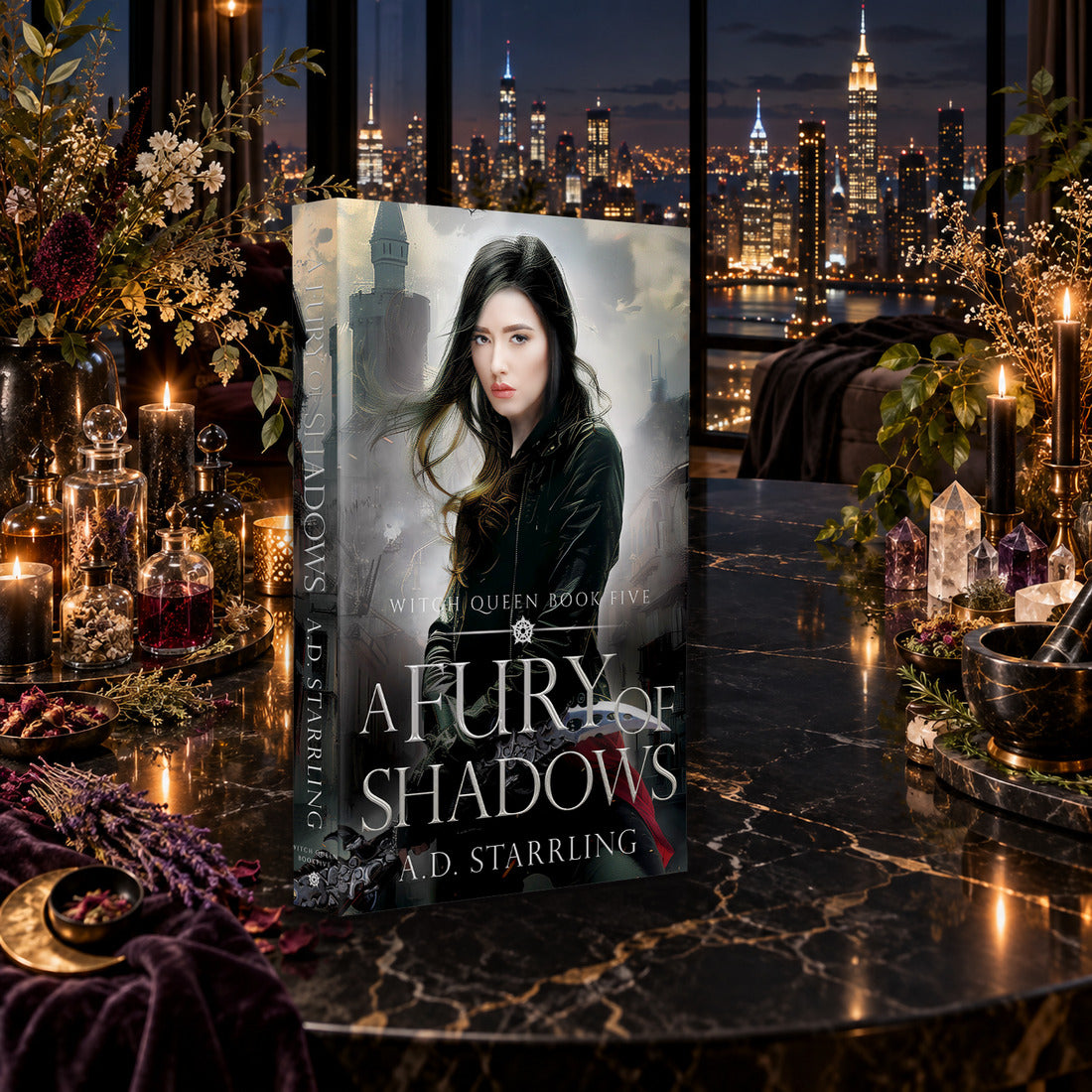 A Fury of Shadows (Witch Queen Book 5) Paperback by A.D. Starrling on a marble table among crystals and candles with the New York skyline at night