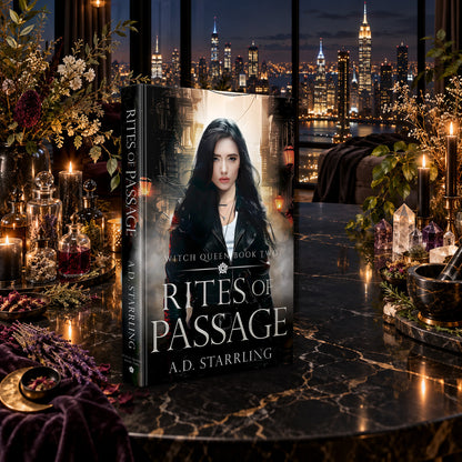 Rites of Passage (Witch Queen Book 2) Hardback by A.D. Starrling on a marble table among crystals and candles with the New York skyline at night