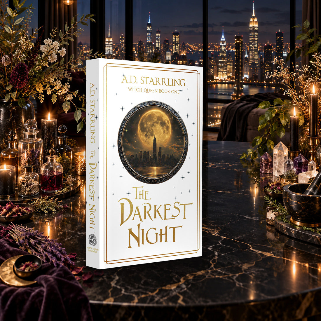 The Darkest Night (Witch Queen Book 1) Special Edition Paperback by A.D. Starrling on a marble table among crystals and candles with the New York skyline at night