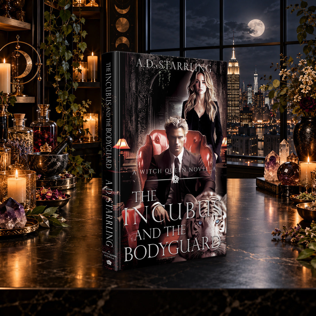 The Incubus and the Bodyguard (A Witch Queen Novella) Hardback by A.D. Starrling on a marble table by a moonlit window over the New York skyline