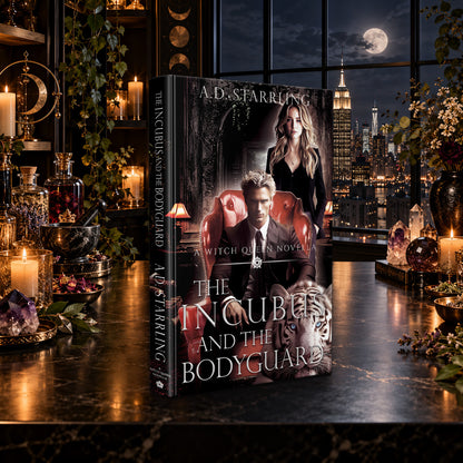 The Incubus and the Bodyguard (A Witch Queen Novella) Hardback by A.D. Starrling on a marble table by a moonlit window over the New York skyline