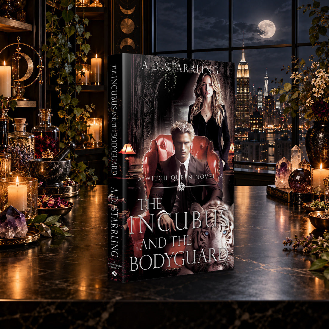 The Incubus and the Bodyguard (A Witch Queen Novella) Paperback by A.D. Starrling on a marble table by a moonlit window over the New York skyline