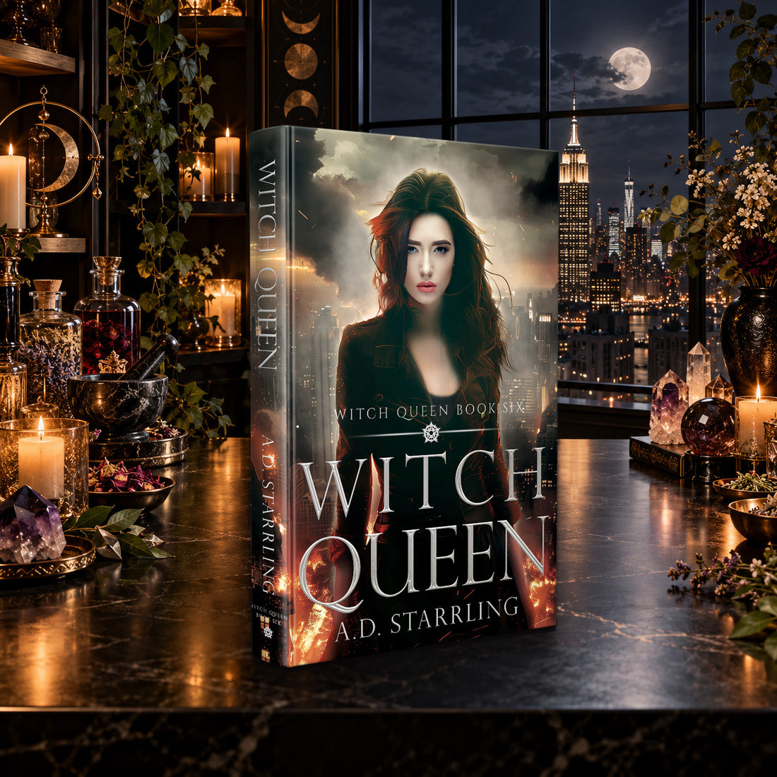 Witch Queen (Witch Queen Book 6) Hardback by A.D. Starrling on a marble table by a moonlit window over the New York skyline