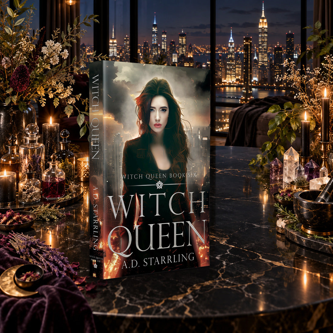 Witch Queen (Witch Queen Book 6) Paperback by A.D. Starrling on a marble table among crystals and candles with the New York skyline at night